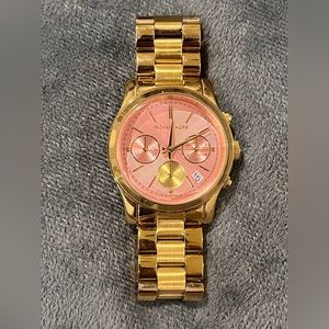 MK Rose gold inside And gold all around watch